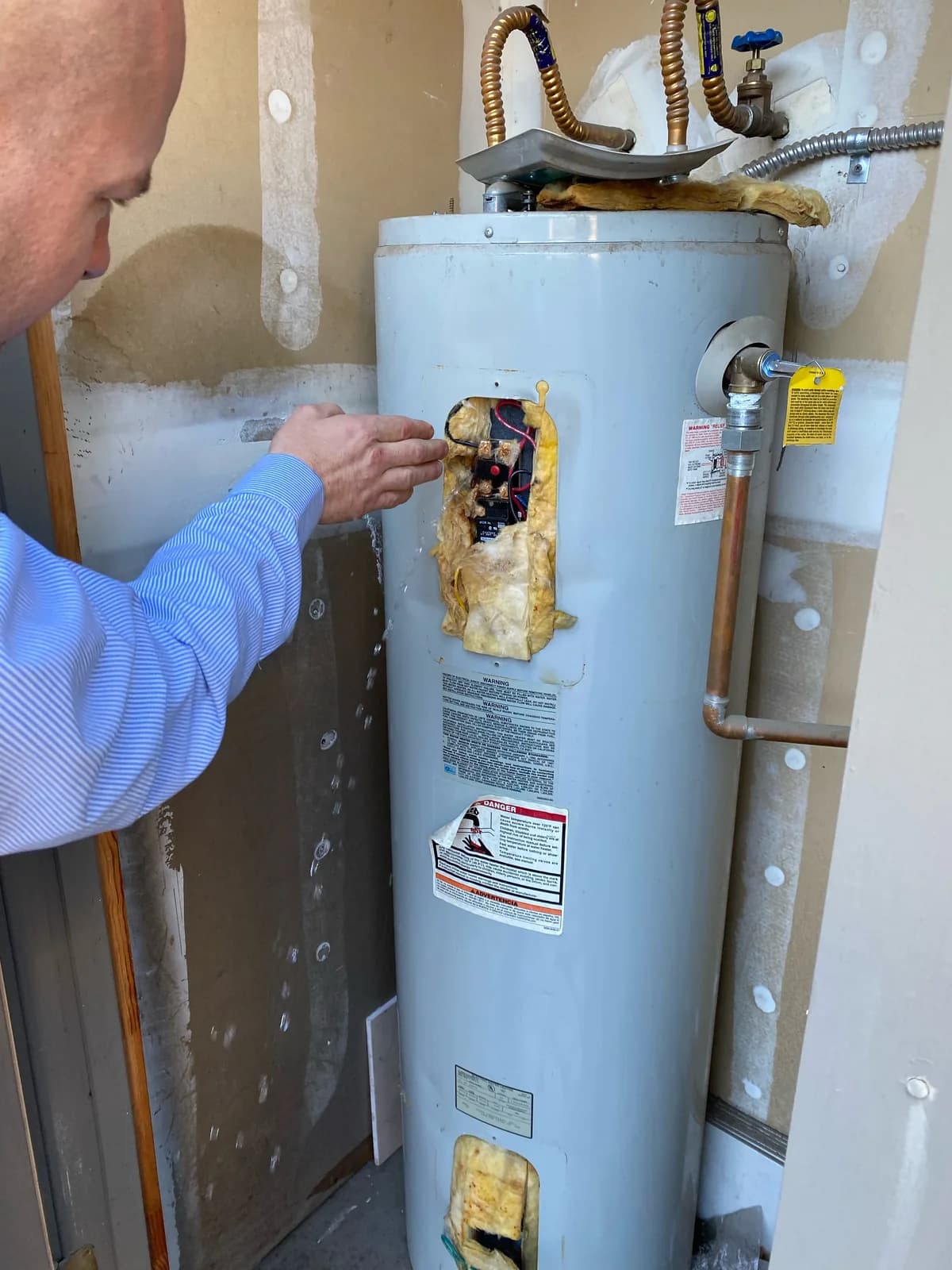 Chris diagnosing a leaking tank water heater