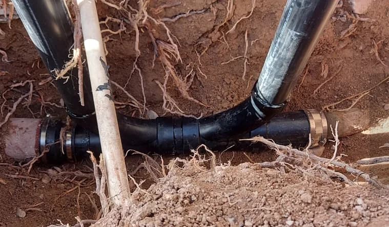 Replacement drain line fittings installed below grade