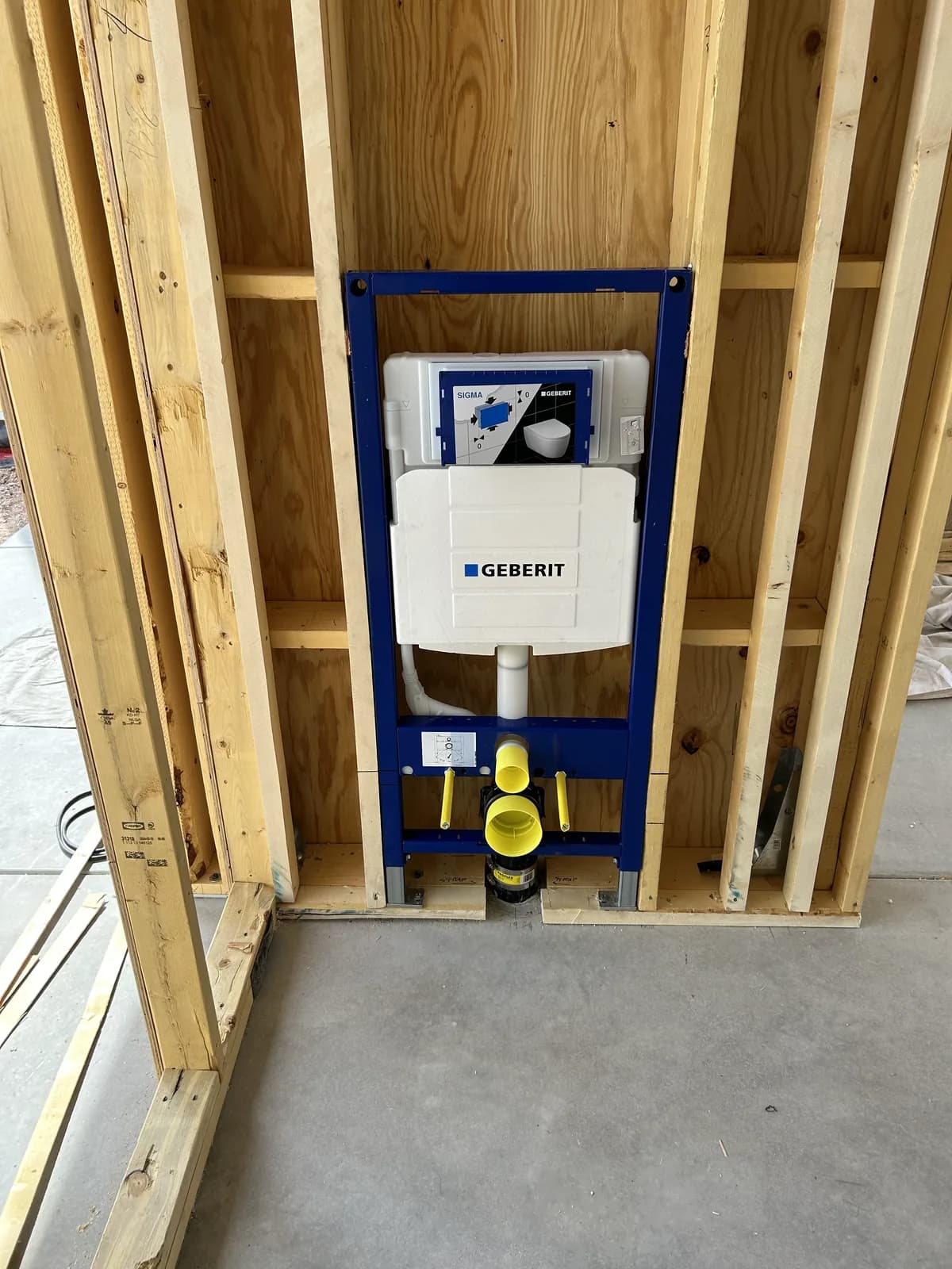 Geberit in-wall carrier and concealed cistern roughed into new framing for a wall-hung toilet