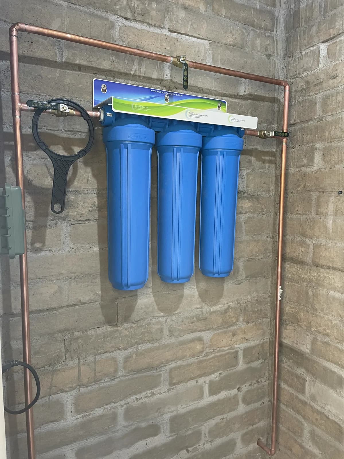Three-stage whole-home water filter installation